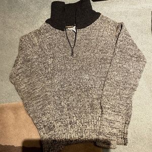 Royal Robbins Mens light and dark grey sweater in tan background